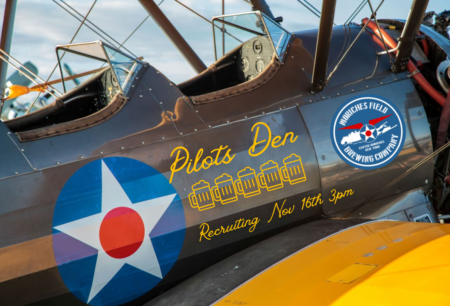 Biplane with Pilot's Den logo for Moriches Field Brewing Co