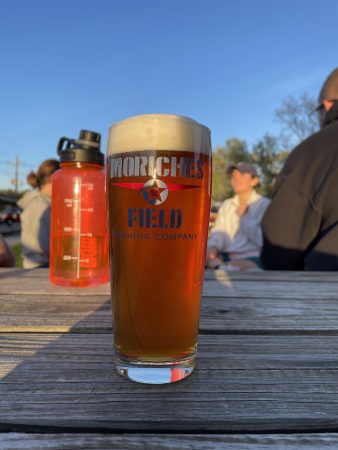 A pint of Southern C's IPA sitting on a picnic table